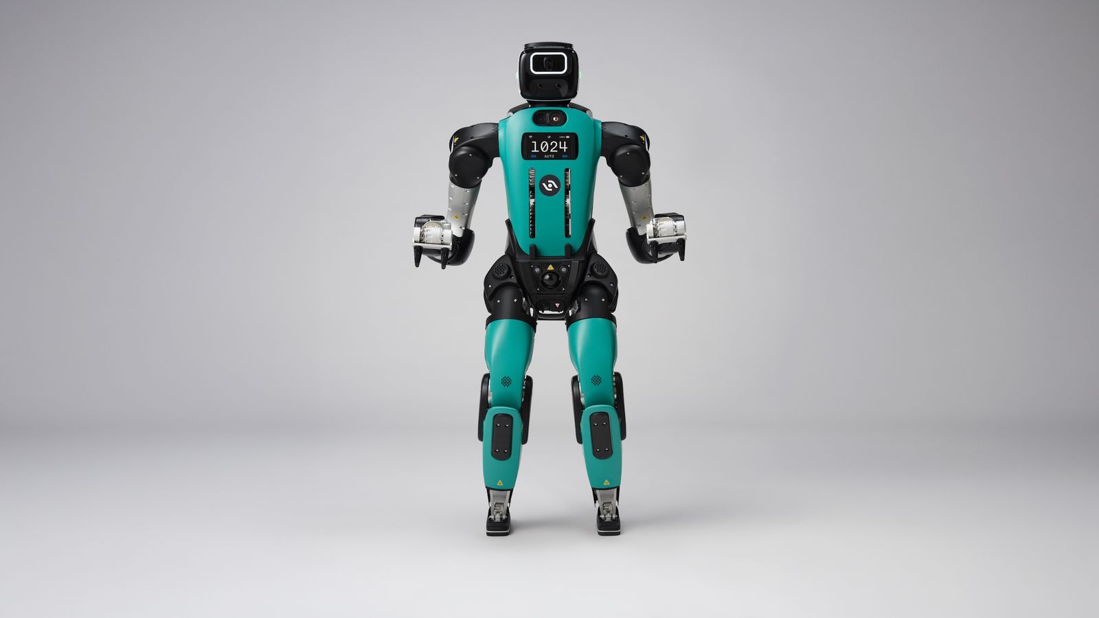 Agility Robotics Digit 5 shown from the front with a compact head, teal torso, industrial arms, and redesigned bipedal legs